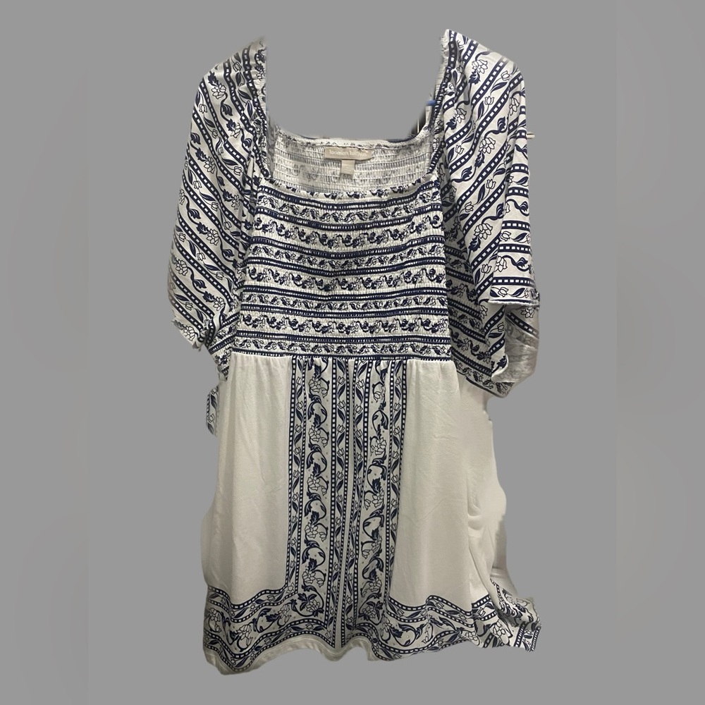 An easy babydoll silhouette with an intricate border print. New without tag!